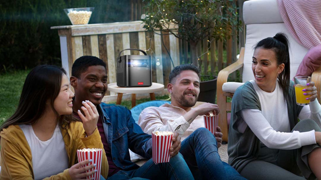 Outdoor movie night with Vision Beam Max projector and friends